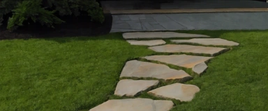 Cape Sands Travertine Pavers displaying a soft beige hue with natural veining and a textured surface, ideal for adding a touch of elegance to outdoor patios and walkways